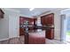 Lovely kitchen with dark wood cabinets, granite countertops, and stainless steel appliances at 11514 Hattie Little St, Charlotte, NC 28269