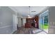 Well-lit kitchen with an island, modern appliances, and sliding glass doors to the backyard at 11514 Hattie Little St, Charlotte, NC 28269