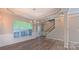 Bright living room featuring elegant lighting, crown molding, and wood floors at 11514 Hattie Little St, Charlotte, NC 28269