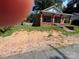 Exterior shot of a brick home, featuring the front yard and porch area at 119 Hemlock Ave, Kannapolis, NC 28081