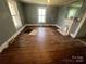Unfurnished living room featuring wood floors, natural light, and a decorative fireplace at 119 Hemlock Ave, Kannapolis, NC 28081