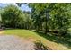 Expansive backyard featuring a well-maintained lawn and lush trees for privacy and shade at 124 Julius Ln, Mooresville, NC 28117