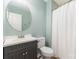 The bathroom has a large vanity, a round mirror, and a shower with a curtain at 124 Julius Ln, Mooresville, NC 28117