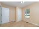 A quaint bedroom features neutral walls, carpet floors, and a window with a view of the outdoors at 124 Julius Ln, Mooresville, NC 28117