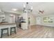 Open layout kitchen featuring bar seating and stainless steel appliances for cooking and entertaining at 124 Julius Ln, Mooresville, NC 28117