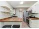 Bright kitchen features a breakfast bar, stainless steel appliances, and butcher block countertops at 124 Julius Ln, Mooresville, NC 28117