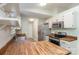 A well-lit kitchen features butcher block counters, stainless appliances, and light colored cabinets at 124 Julius Ln, Mooresville, NC 28117