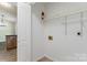 The laundry room has bright, painted walls and wire rack shelving for optimal storage at 124 Julius Ln, Mooresville, NC 28117