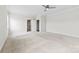 Spacious bedroom with neutral carpet, ceiling fan and walk-in closet at 1300 Dali Blvd, Mount Holly, NC 28120