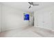 Well-lit bedroom featuring a fan, closet, and colorful art that create a lively and comforting atmosphere at 1300 Dali Blvd, Mount Holly, NC 28120