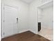 Welcoming entryway with sleek hardwood flooring, leading to a mudroom with a sink, cabinets, and storage at 1300 Dali Blvd, Mount Holly, NC 28120