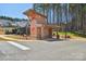 A modern bath house and outdoor water fountain with a cantilevered roof, conveniently located near the community pool at 1300 Dali Blvd, Mount Holly, NC 28120