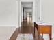 Elegant entryway featuring hardwood floors, a table, and an open view to the rest of the home at 1300 Dali Blvd, Mount Holly, NC 28120