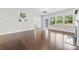 Living area featuring hardwood floors, a fireplace, and a doorway to the outside at 1300 Dali Blvd, Mount Holly, NC 28120