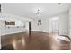 Open living room featuring hardwood floors and open concept kitchen at 1300 Dali Blvd, Mount Holly, NC 28120