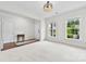 Bright and spacious living room with neutral walls, large windows, and new carpet at 1300 Dali Blvd, Mount Holly, NC 28120