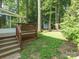 Exterior deck leading to a partially wooded backyard with storage shed at 13037 Angel Oak Dr, Huntersville, NC 28078