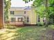 Spacious backyard featuring a large deck, mature trees, and a well-maintained lawn, creating a private outdoor retreat at 13037 Angel Oak Dr, Huntersville, NC 28078