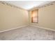 Carpeted bedroom featuring neutral walls and window with blinds at 13037 Angel Oak Dr, Huntersville, NC 28078