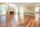 Spacious living room with hardwood floors, fireplace, and arched windows that offer lots of natural light at 13037 Angel Oak Dr, Huntersville, NC 28078
