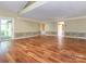 Open-concept living space with hardwood flooring, and multiple entryways, providing flexibility and functionality at 13037 Angel Oak Dr, Huntersville, NC 28078