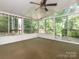 Screened-in porch featuring ceiling fan and access to outdoor deck at 13037 Angel Oak Dr, Huntersville, NC 28078