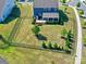Aerial view of a fenced-in backyard with a patio, landscaping, and a well-manicured lawn at 1324 Mona Vale Dr, Huntersville, NC 28078