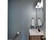 Stylish half-bathroom features modern fixtures and wood-look vanity at 1324 Mona Vale Dr, Huntersville, NC 28078