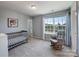 Bright Bedroom with a window, rocking chair, and crib at 1324 Mona Vale Dr, Huntersville, NC 28078
