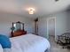 Bright bedroom with a view of a closet, an antique dresser with mirror, and a comfy chair at 1324 Mona Vale Dr, Huntersville, NC 28078