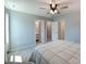 Bedroom with ceiling fan and neutral walls featuring carpet floors and two entry doorways at 1324 Mona Vale Dr, Huntersville, NC 28078