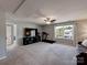 Large bonus room with comfortable sofa seating and window view at 1324 Mona Vale Dr, Huntersville, NC 28078