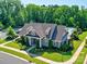 Aerial view of a clubhouse and pool featuring landscaped surroundings and community amenities at 1324 Mona Vale Dr, Huntersville, NC 28078