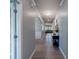 Bright hallway featuring an arched entrance, clean gray walls, and modern wood-look floors at 1324 Mona Vale Dr, Huntersville, NC 28078
