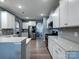 Spacious kitchen featuring white cabinets, stainless steel appliances, and an open layout for easy entertaining at 1324 Mona Vale Dr, Huntersville, NC 28078
