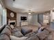 Cozy living room with a charming fireplace, wooden accent wall, and comfortable seating arrangement at 1324 Mona Vale Dr, Huntersville, NC 28078