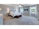 Bright main bedroom with two windows, bedside lamps, and stylish decorations at 1324 Mona Vale Dr, Huntersville, NC 28078
