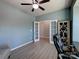 Another view of the home office showcasing ample space, a stylish cabinet, and double doors to another room at 1324 Mona Vale Dr, Huntersville, NC 28078