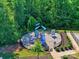 A community playground with slides and other outdoor activities nestled amongst mature trees at 1324 Mona Vale Dr, Huntersville, NC 28078