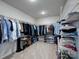 Spacious walk-in closet, featuring shelving, and many hanging clothes at 1324 Mona Vale Dr, Huntersville, NC 28078