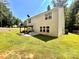 Spacious backyard featuring a covered patio and lush green lawn, perfect for outdoor entertaining and relaxation at 1528 Magnolia Dr # 8, Lancaster, SC 29720