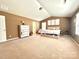 Spacious bedroom featuring vaulted ceilings, light-filled with carpet and neutral color palette at 1528 Magnolia Dr # 8, Lancaster, SC 29720