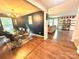 Elegant dining room boasts a glass top table, stylish seating, modern chandelier, and hardwood flooring at 1528 Magnolia Dr # 8, Lancaster, SC 29720