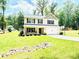 Inviting two-story home features a well-manicured lawn, two-car garage, and a basketball hoop on the driveway at 1528 Magnolia Dr # 8, Lancaster, SC 29720