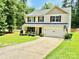 Attractive two-story home features a two-car garage, well-maintained lawn, and a driveway with a basketball hoop at 1528 Magnolia Dr # 8, Lancaster, SC 29720