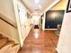 Inviting hallway showcases hardwood floors, a staircase, wall decor, and access to multiple rooms at 1528 Magnolia Dr # 8, Lancaster, SC 29720