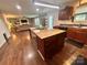 Open concept kitchen with a center island, stainless steel appliances, and hardwood flooring at 1528 Magnolia Dr # 8, Lancaster, SC 29720