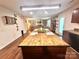 Spacious kitchen with island that has a hardwood countertop, ample storage, modern appliances and hardwood floors at 1528 Magnolia Dr # 8, Lancaster, SC 29720