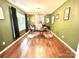 Stylish home office features olive walls, unique transparent seating, sleek desk, and hardwood floors at 1528 Magnolia Dr # 8, Lancaster, SC 29720