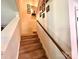 Carpeted stairway with wood railing leading to the upper level of the home at 1528 Magnolia Dr # 8, Lancaster, SC 29720